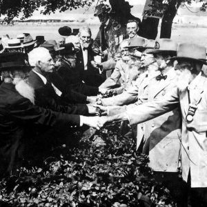 Photo taken at the 50th anniversary of the Battle of Gettysburg, where union and confederate veterans shake hands in a symbolic act of reconciliation. 